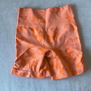 Orange camo spandex shorts